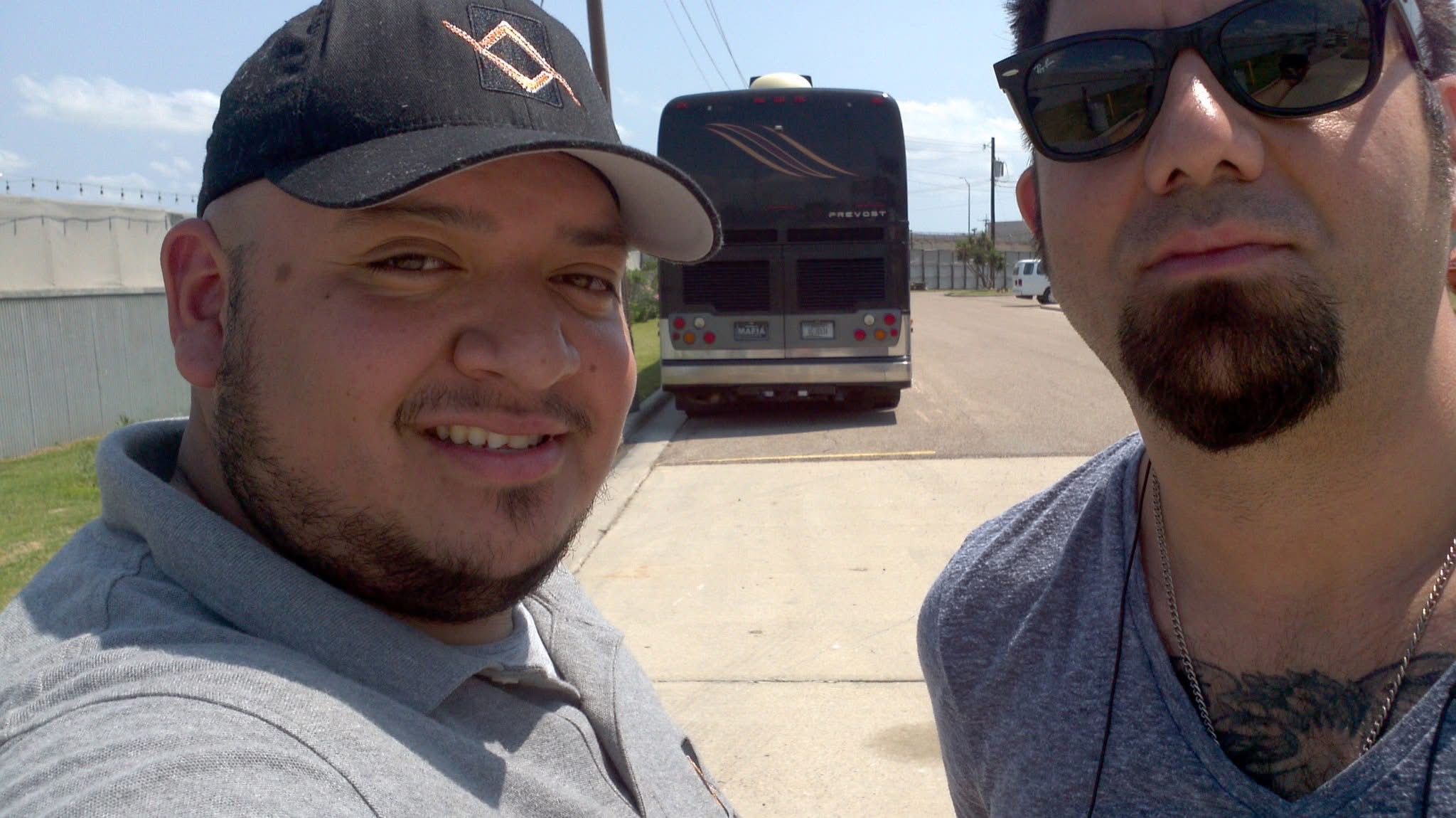 Selfie of Tanner with Chino Moreno by the Deftones tour bus at Concrete Street Amphitheater.