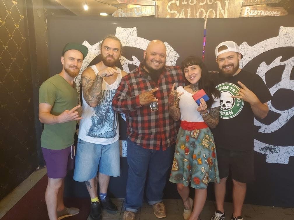 Tanner with the members of Jinjer at a meet and greet, Come and Take It Saloon, Austin.
